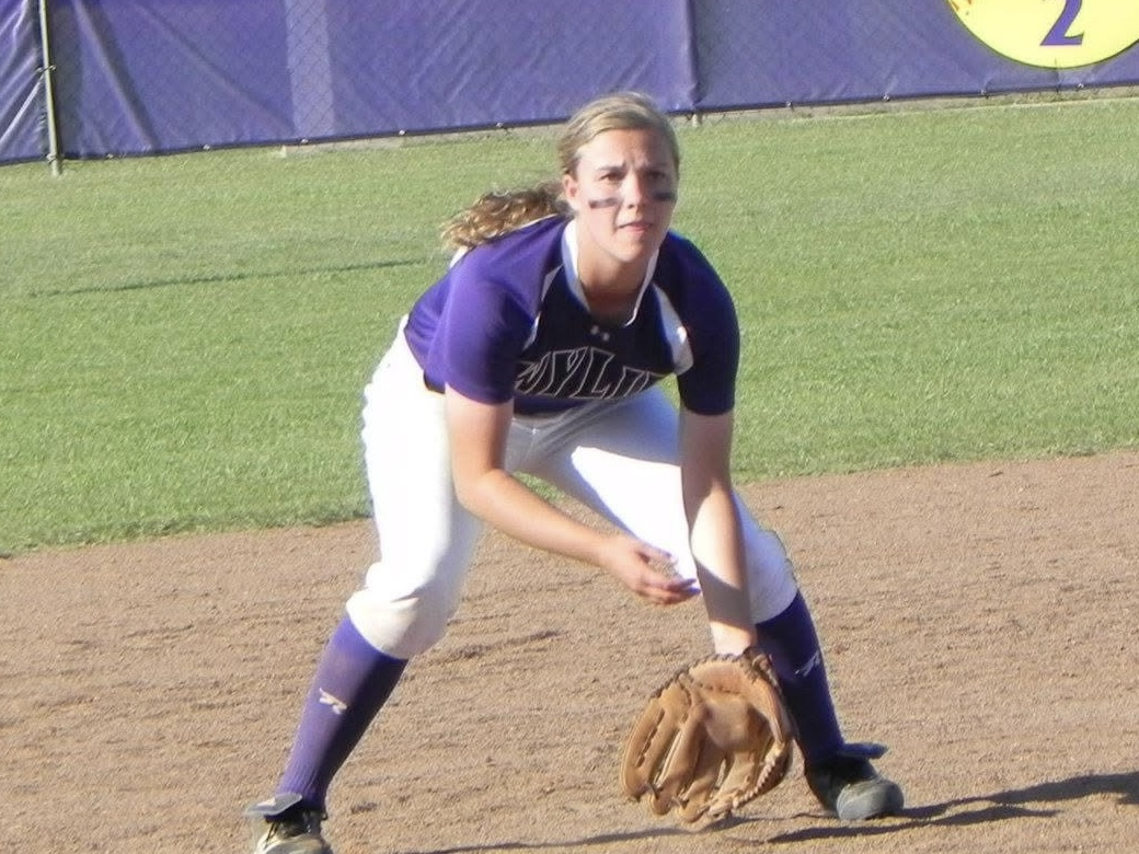 Brianna Halford standing on a softball field